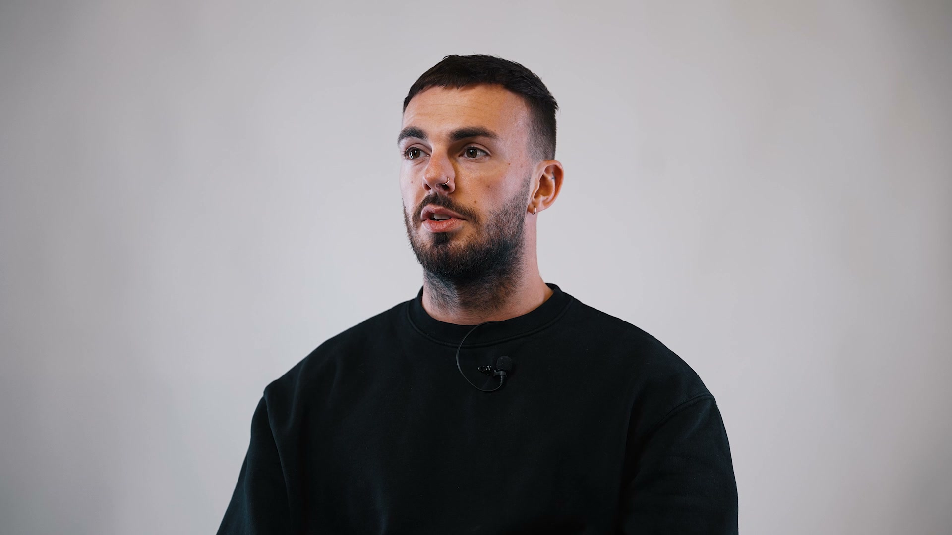 Medical aesthetics patient discussing his experience at follow-up