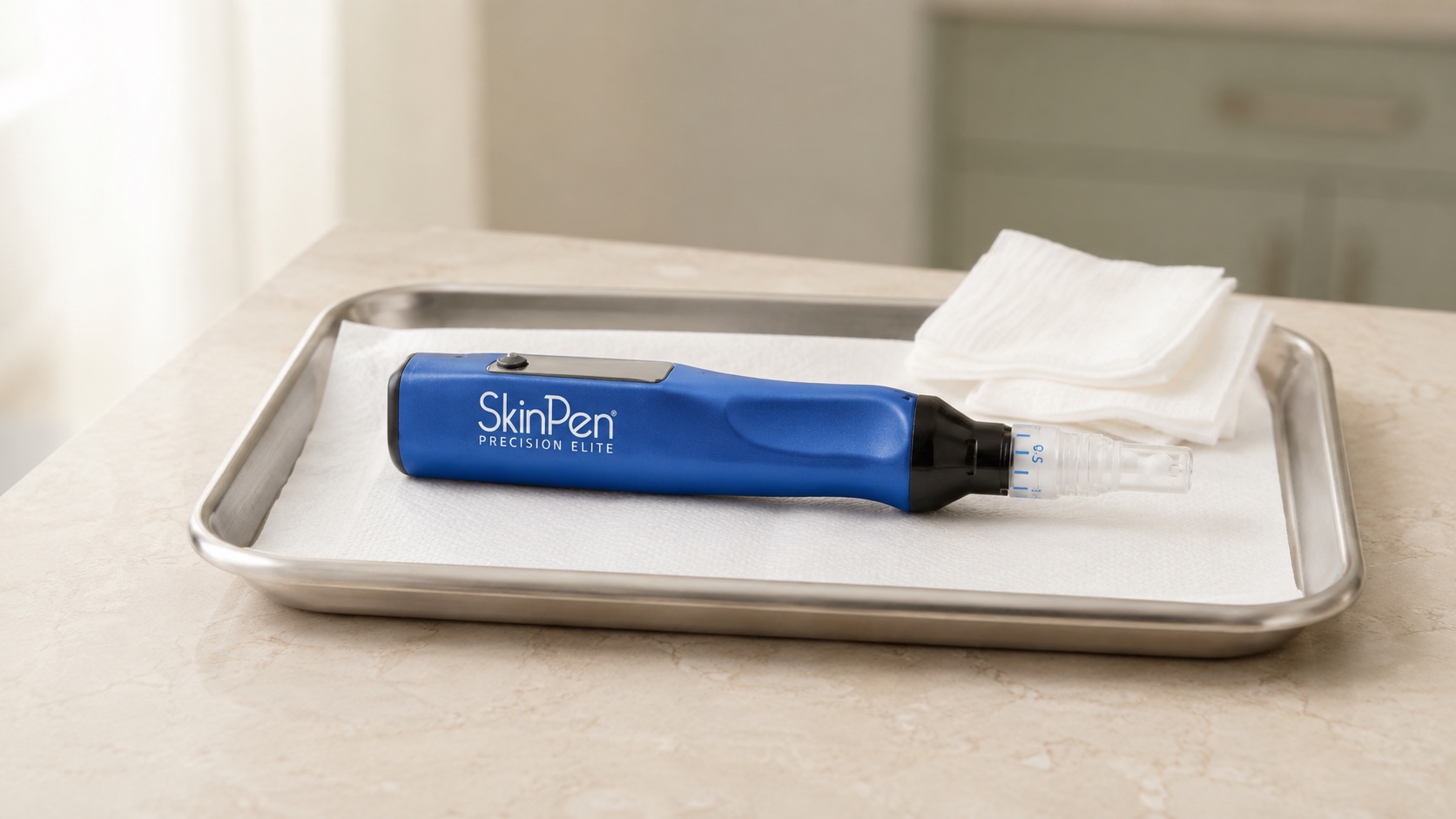 Illustrative SkinPen Precision Elite handpiece resting on a clean clinical tray beside gauze